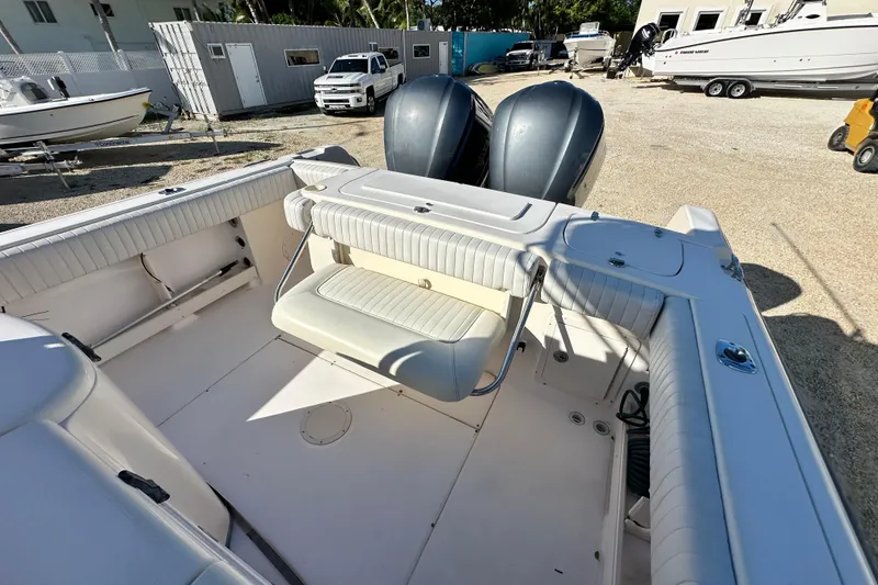 Slide: The Image of 2005 Grady-White Release 283 boat interior with seating and dual outboard engines. - 20