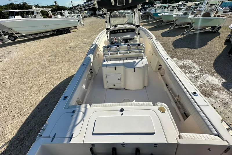 Slide: The Image of 2005 Grady-White Release 283 boat interior, showcasing spacious seating and helm area. - 7