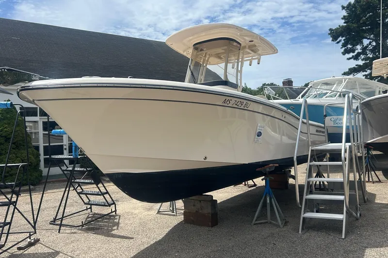 Slide: The Image of 2023 Grady-White Fisherman boat on stands, featuring Yamaha outboard motor. - 2