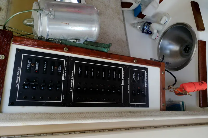 Slide: The Image of Electrical panel and sink area on a 2000 Atlas Boat Works Acadia 25. - 21