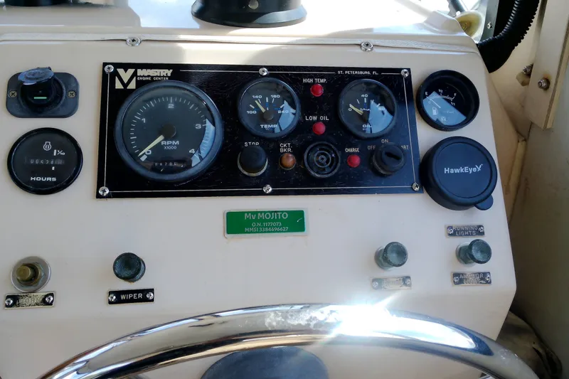 Slide: The Image of Control panel of a 2000 Atlas Boat Works Acadia 25 with gauges and switches. - 24