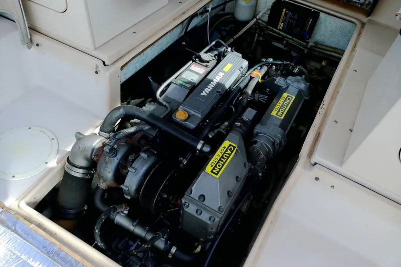 Slide: The Image of Engine compartment of 2000 Atlas Boat Works Acadia 25, featuring a Yanmar engine. - 17