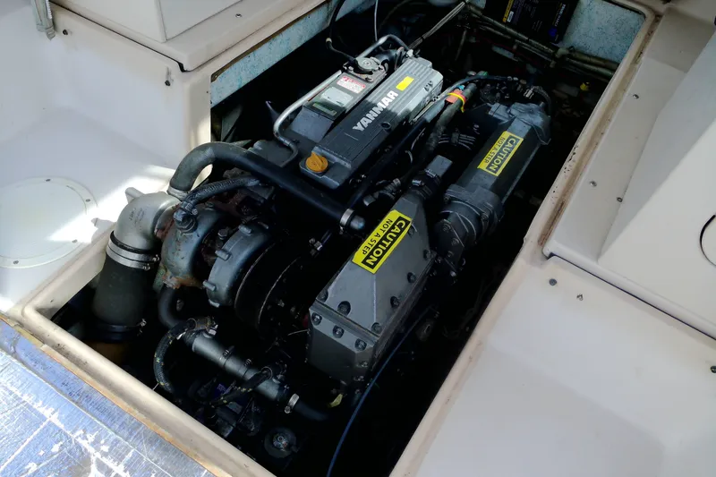 Slide: The Image of Engine compartment of 2000 Atlas Boat Works Acadia 25, featuring a Yanmar engine. - 18