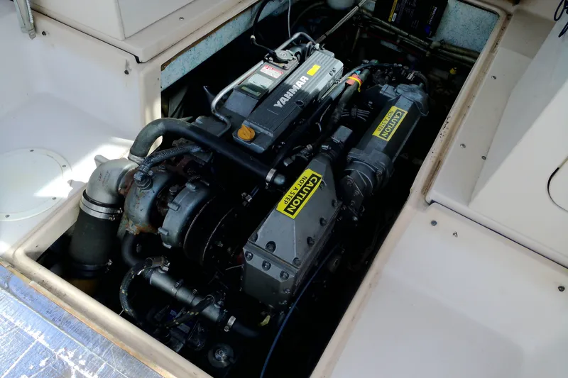 Slide: The Image of Engine compartment of 2000 Atlas Boat Works Acadia 25, featuring a Yanmar engine. - 19