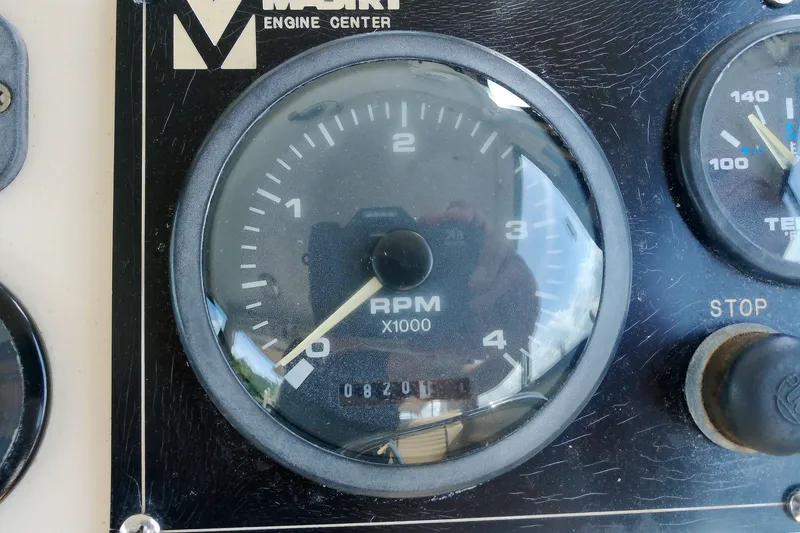 Slide: The Image of Close-up of a 2000 Atlas Boat Works Acadia 25 RPM gauge, showing 0.8 RPM x1000. - 26