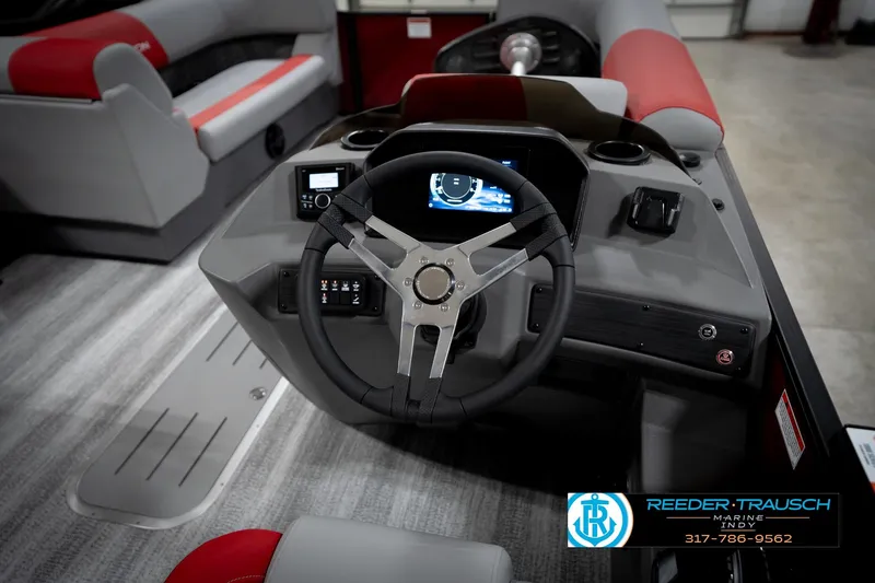 Slide: The Image of 2026 Bennington 22 SLJ boat interior with steering wheel and dashboard controls. - 29