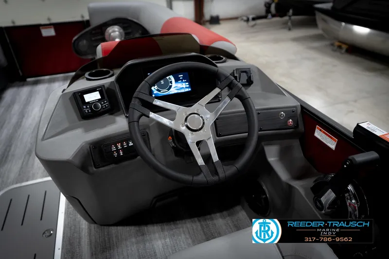 Slide: The Image of 2026 Bennington 22 SLJ boat dashboard with steering wheel and control panel. - 30