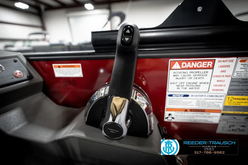 Slide: The Image of Throttle control and safety warnings on 2026 Bennington 22 SLJ boat dashboard. - 37