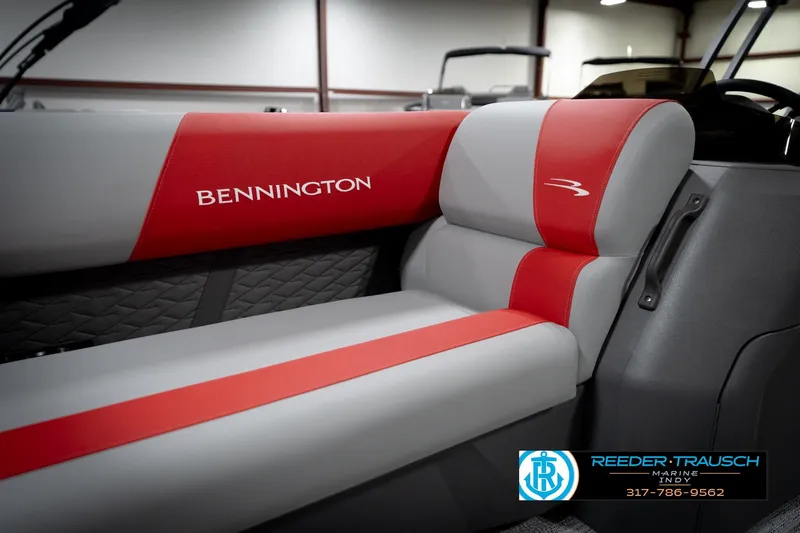 Slide: The Image of 2026 Bennington 22 SLJ boat interior with red and gray seating, Reeder-Trausch Marine logo. - 42