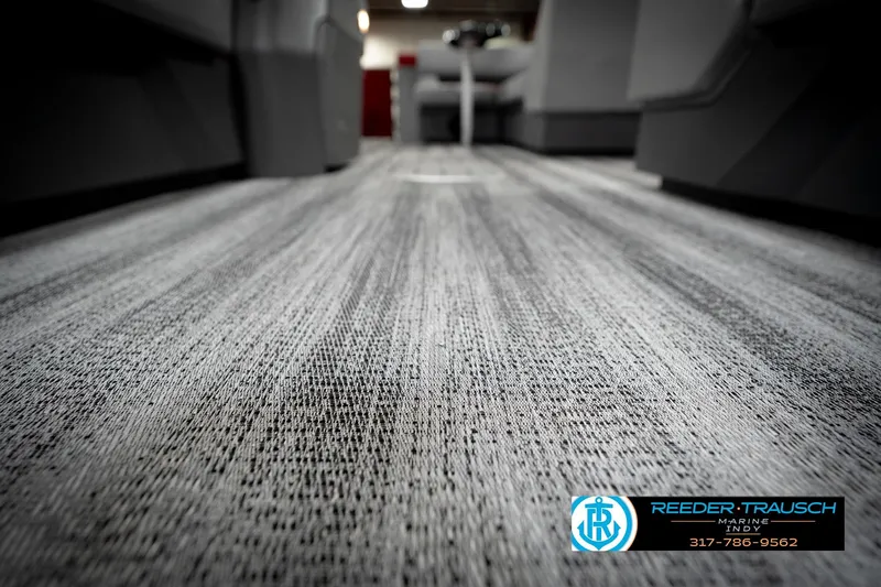 Slide: The Image of 2026 Bennington 22 SLJ interior flooring with modern design, showcased by Reeder-Trausch Marine. - 47