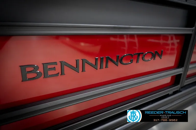Slide: The Image of 2026 Bennington 22 SLJ boat with red and black detailing, Reeder-Trausch Marine logo. - 49