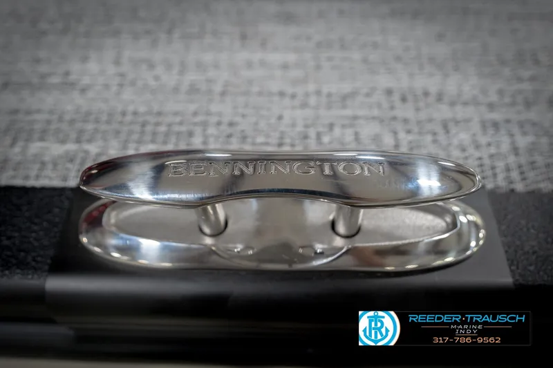 Slide: The Image of Bennington 22 SLJ 2026 boat cleat with engraved branding, Reeder Trausch Marine logo visible. - 54