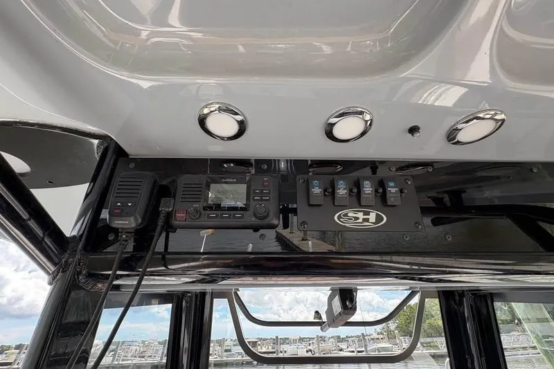 Slide: The Image of 2021 Seahunt 255 Ultra boat dashboard with Garmin electronics and control panel. - 16