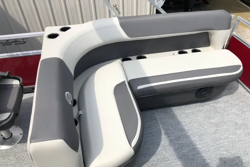 Slide: The Image of 2026 Sun Tracker Bass Buggy 18 DLX pontoon boat seating with cup holders. - 10