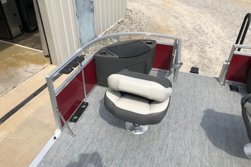 Slide: The Image of 2026 Sun Tracker Bass Buggy 18 DLX pontoon boat interior with seating and storage. - 11