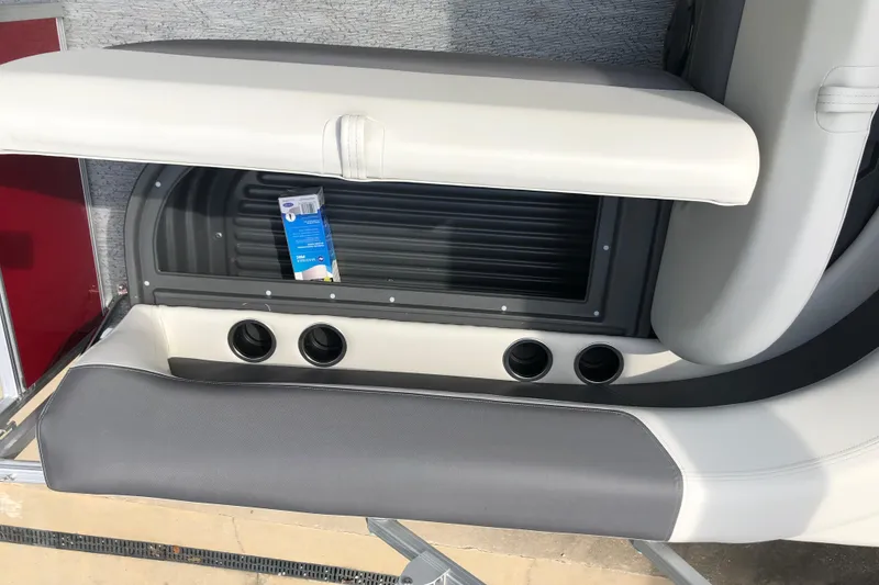 Slide: The Image of 2026 Sun Tracker Bass Buggy 18 DLX boat seating and storage compartment. - 14