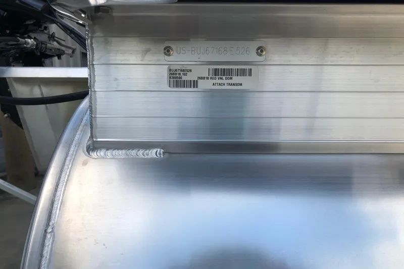 Slide: The Image of 2026 Sun Tracker Bass Buggy 18 DLX transom with serial number and barcode. - 17