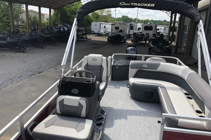 Slide: The Image of 2026 Sun Tracker Bass Buggy 18 DLX pontoon boat with spacious seating and modern design. - 5