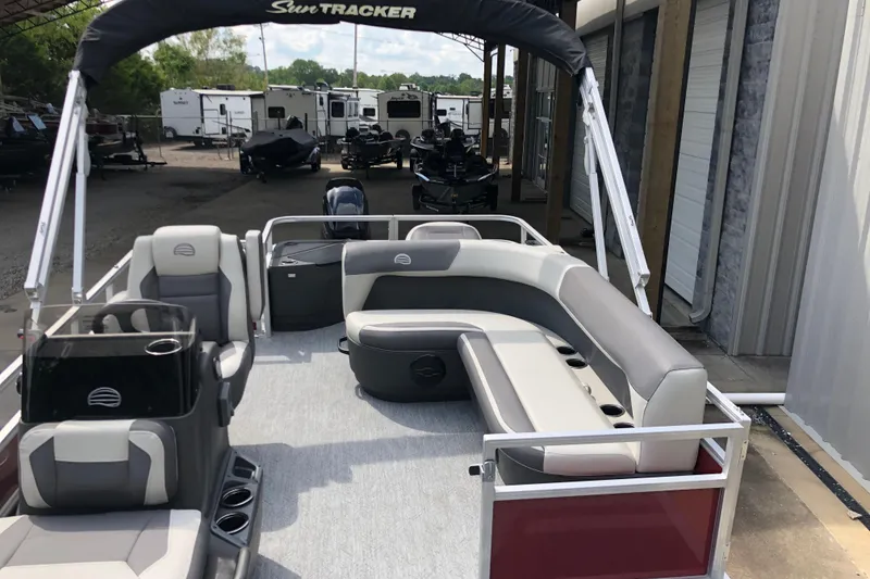 Slide: The Image of 2026 Sun Tracker Bass Buggy 18 DLX pontoon boat with spacious seating and modern design. - 6