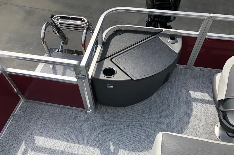 Slide: The Image of 2026 Sun Tracker Bass Buggy 18 DLX pontoon boat interior with seating and storage. - 7