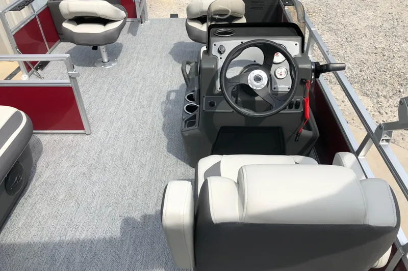 Slide: The Image of 2026 Sun Tracker Bass Buggy 18 DLX interior with steering console and seating. - 9