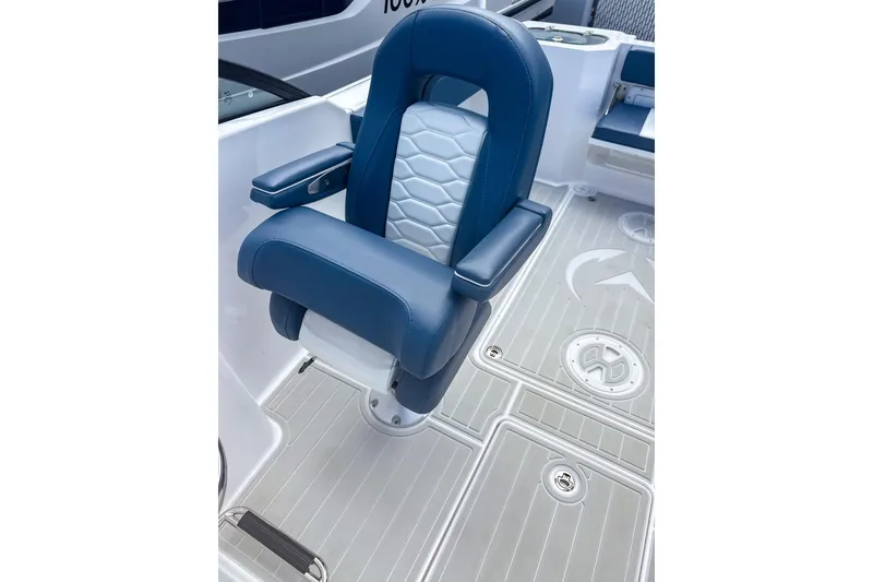 Slide: The Image of Blue captain's chair on 2024 Aquasport AS DC 22 boat, featuring sleek design and comfortable seating. - 11