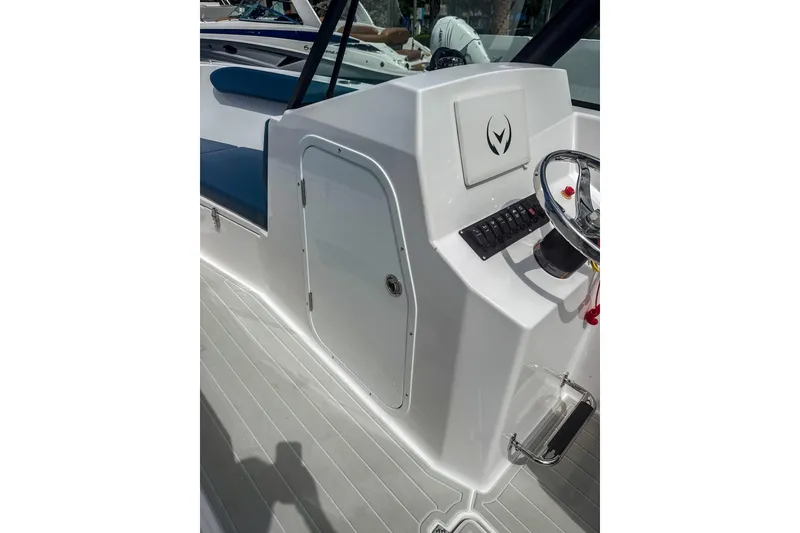 Slide: The Image of 2024 Aquasport AS DC 22 boat console with steering wheel and control panel. - 19
