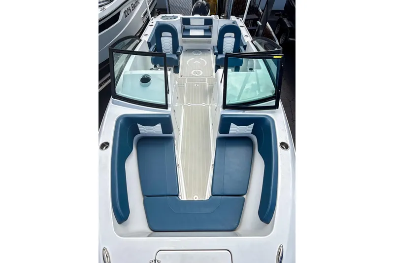 Slide: The Image of 2024 Aquasport AS DC 22 boat interior with blue seating and open windshield. - 24