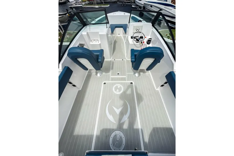 Slide: The Image of 2024 Aquasport AS DC 22 boat interior with blue seating and modern steering console. - 6