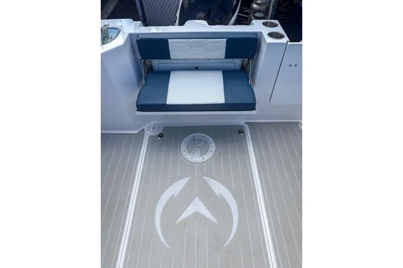 Slide: The Image of 2024 Aquasport AS DC 22 boat interior with blue and white seating and logo on deck. - 8