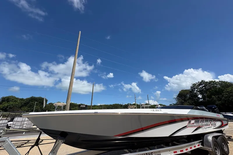 Slide: The Image of 2025 Legend race boat on trailer under clear blue sky. - 5