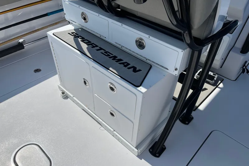 Slide: The Image of 2024 Sportsman Open 252 Center Console boat interior with storage compartments. - 23