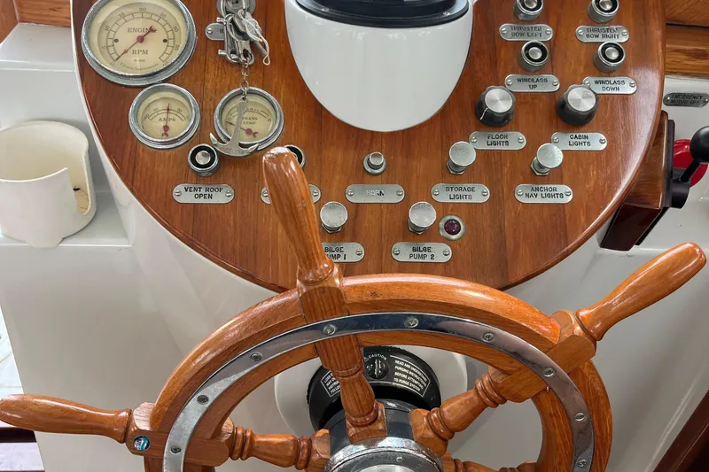 Slide: The Image of Wooden helm and control panel of a 2002 Duffy Electric 30 boat. - 17