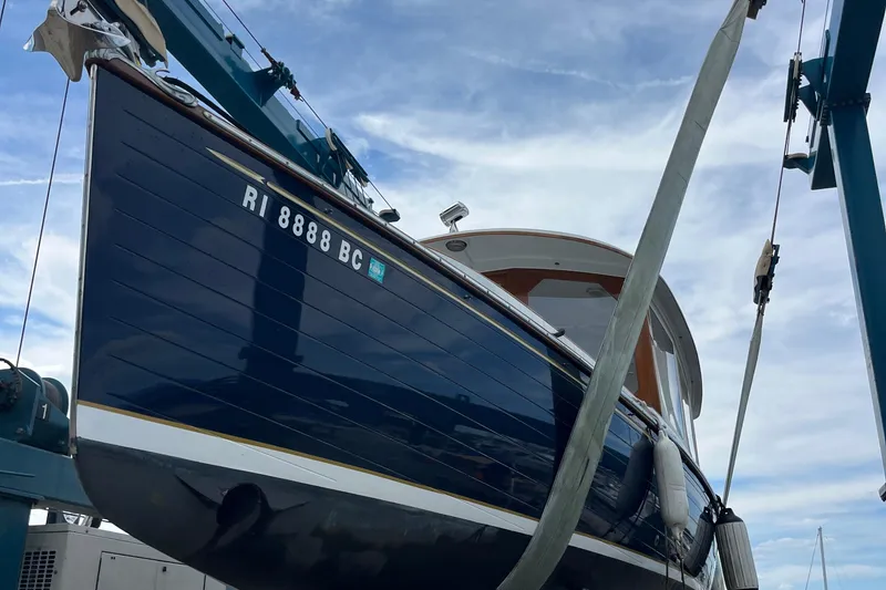 Slide: The Image of 2002 Duffy 30 boat in dry dock, blue hull, registration RI 8888 BC. - 20