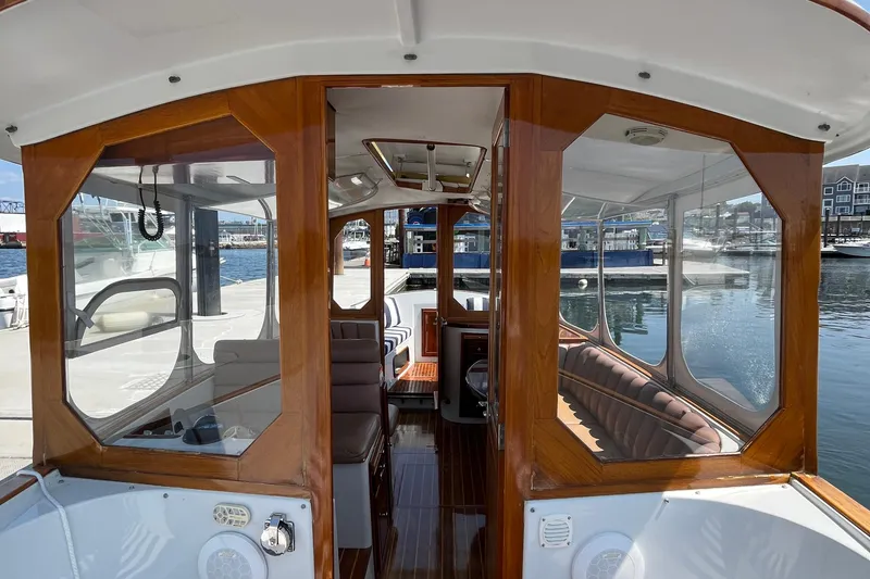 Slide: The Image of Interior view of a 2002 Duffy Electric 30 boat docked at a marina. - 8