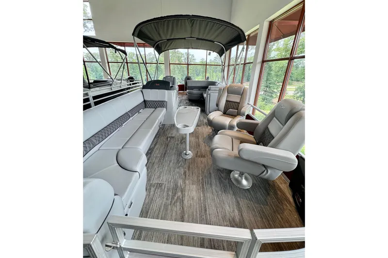 Slide: The Image of Luxurious interior of 2025 Ranger Reata 220FC pontoon boat with plush seating and modern design. - 1