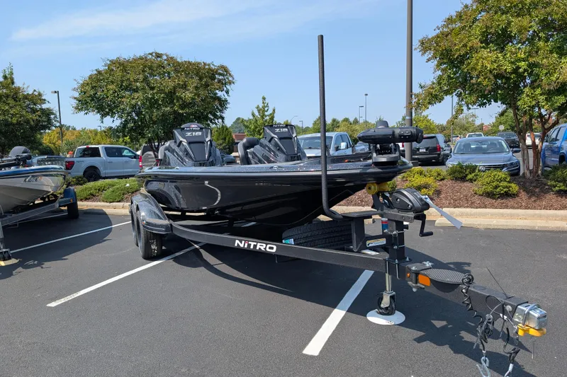 Slide: The Image of 2026 Nitro Z18 Pro boat on trailer in parking lot. - 2