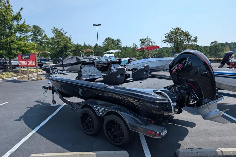 Slide: The Image of 2026 Nitro Z18 Pro boat in parking lot, featuring sleek design and powerful engine. - 4