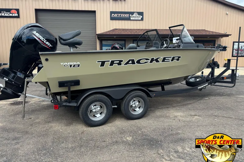 Slide: The Image of 2026 Tracker Targa V-18 Combo boat on trailer, parked outside dealership. - 3