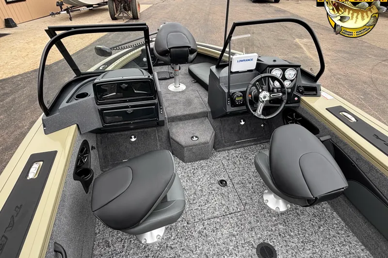 Slide: The Image of 2026 Tracker Targa V-18 Combo boat interior with steering console and seating. - 5