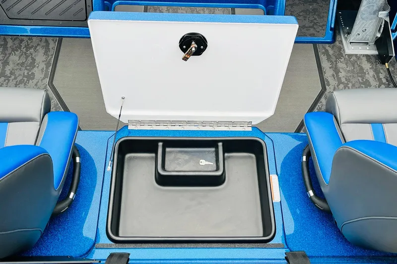 Slide: The Image of 2026 Nitro Z21 XL Pro boat interior with open storage compartment and blue seating. - 105