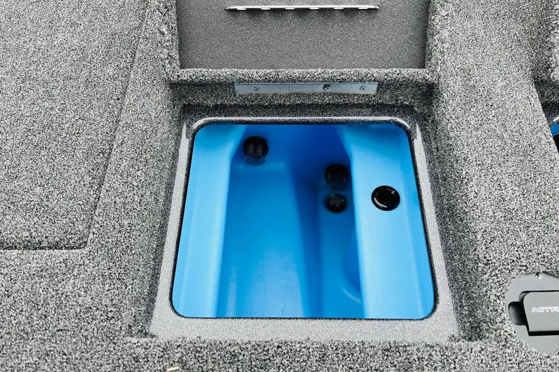 Slide: The Image of Livewell compartment in 2026 Nitro Z21 XL Pro fishing boat, featuring blue interior. - 109