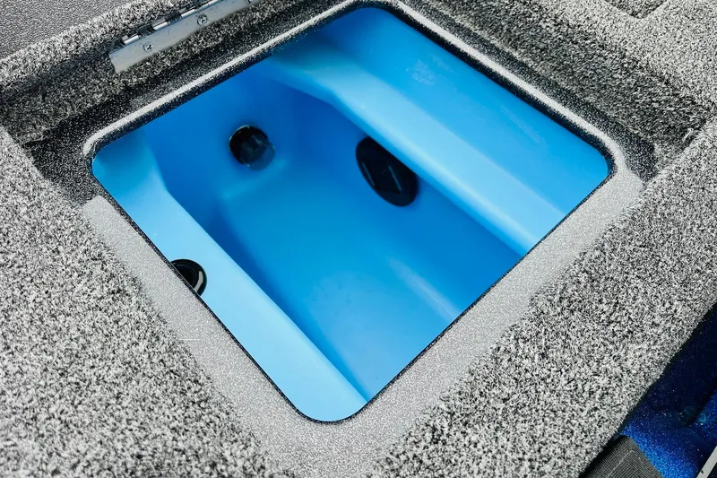 Slide: The Image of 2026 Nitro Z21 XL Pro boat livewell with blue interior and textured gray exterior. - 112