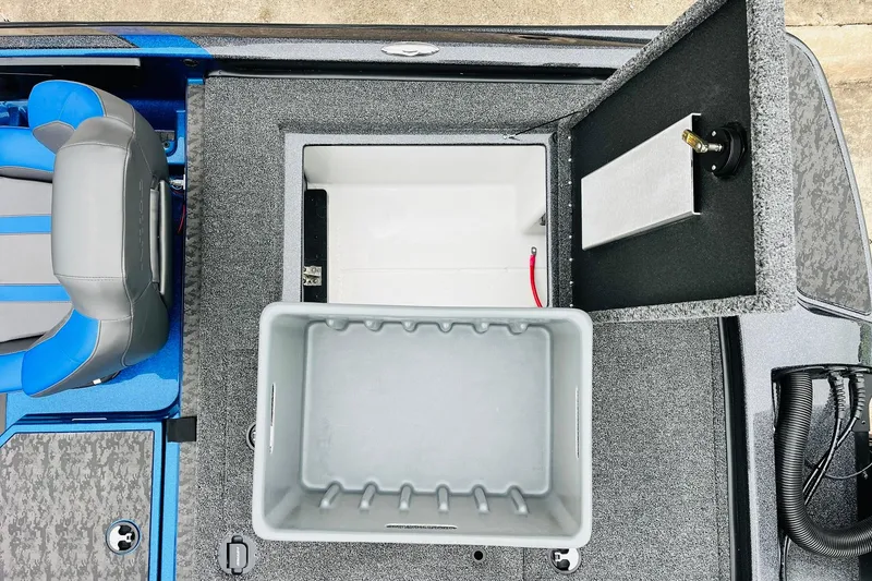 Slide: The Image of 2026 Nitro Z21 XL Pro boat storage compartment with open lid and seating. - 121