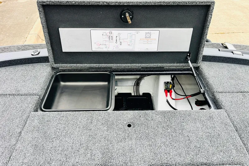 Slide: The Image of Open storage compartment of 2026 Nitro Z21 XL Pro boat, showing wiring and tray. - 122