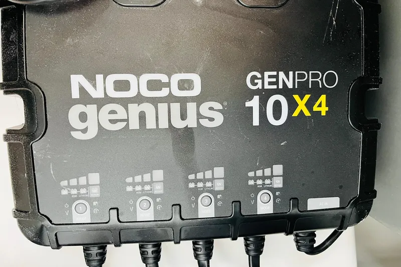 Slide: The Image of NOCO Genius GENPRO 10X4 battery charger on Nitro Z21 XL Pro 2026 model. - 126