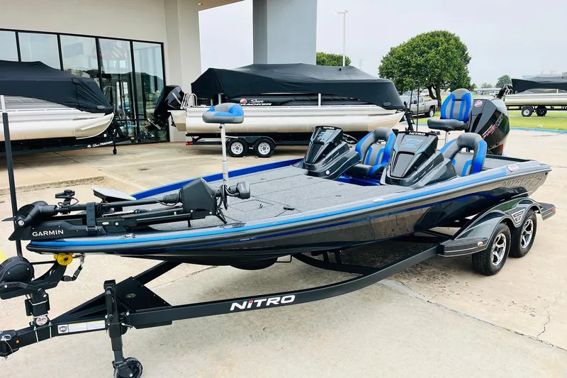 Slide: The Image of 2026 Nitro Z21 XL Pro fishing boat with Garmin equipment, parked outside dealership. - 58