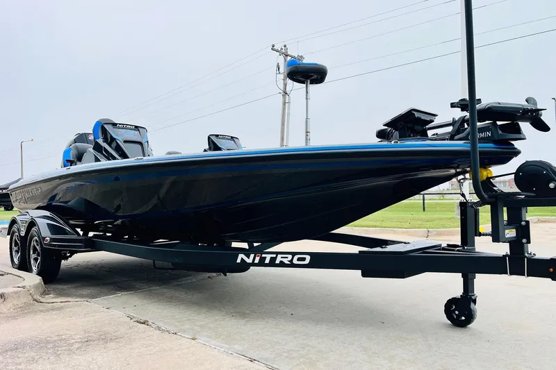 Slide: The Image of 2026 Nitro Z21 XL Pro boat on trailer, sleek design, parked outdoors. - 59