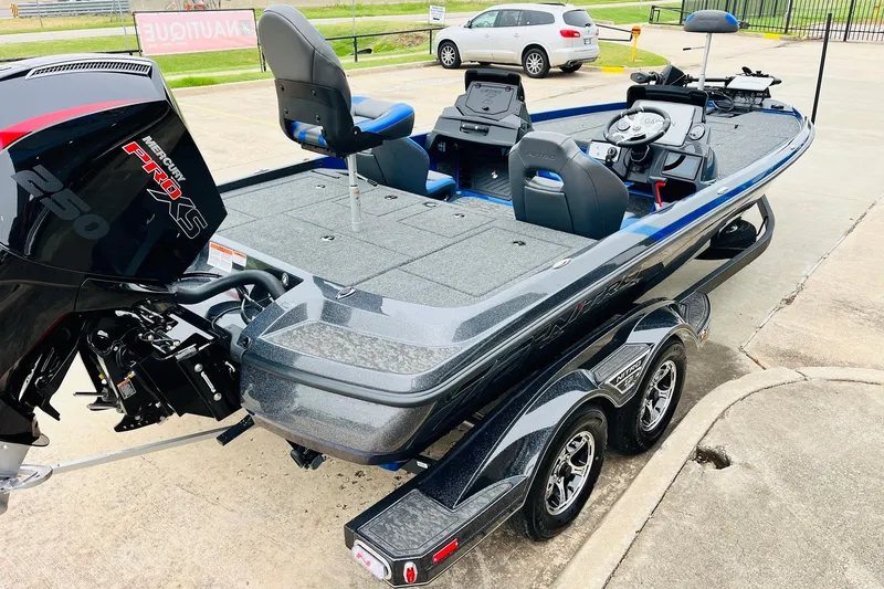 Slide: The Image of 2026 Nitro Z21 XL Pro boat with Mercury Pro XS engine, parked on a trailer. - 63