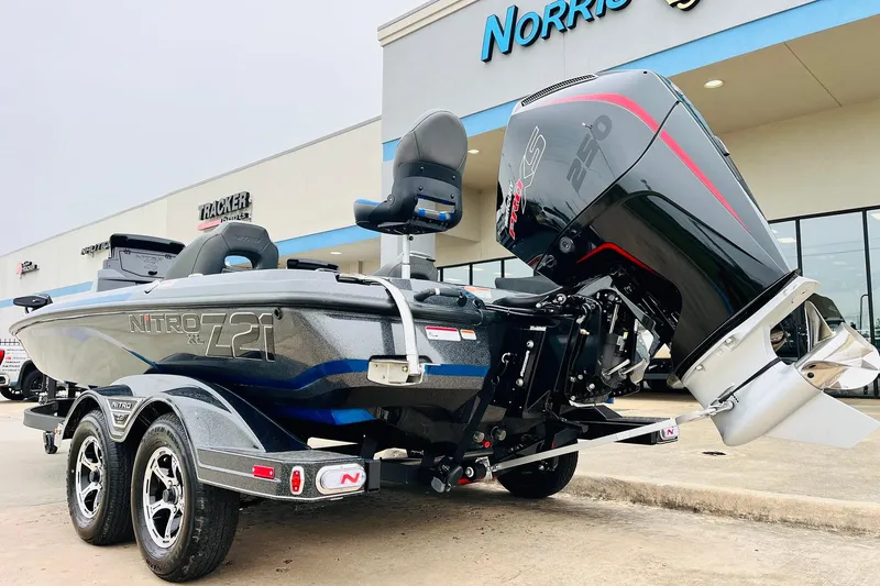 Slide: The Image of 2026 Nitro Z21 XL Pro boat with powerful engine, parked outside dealership. - 65